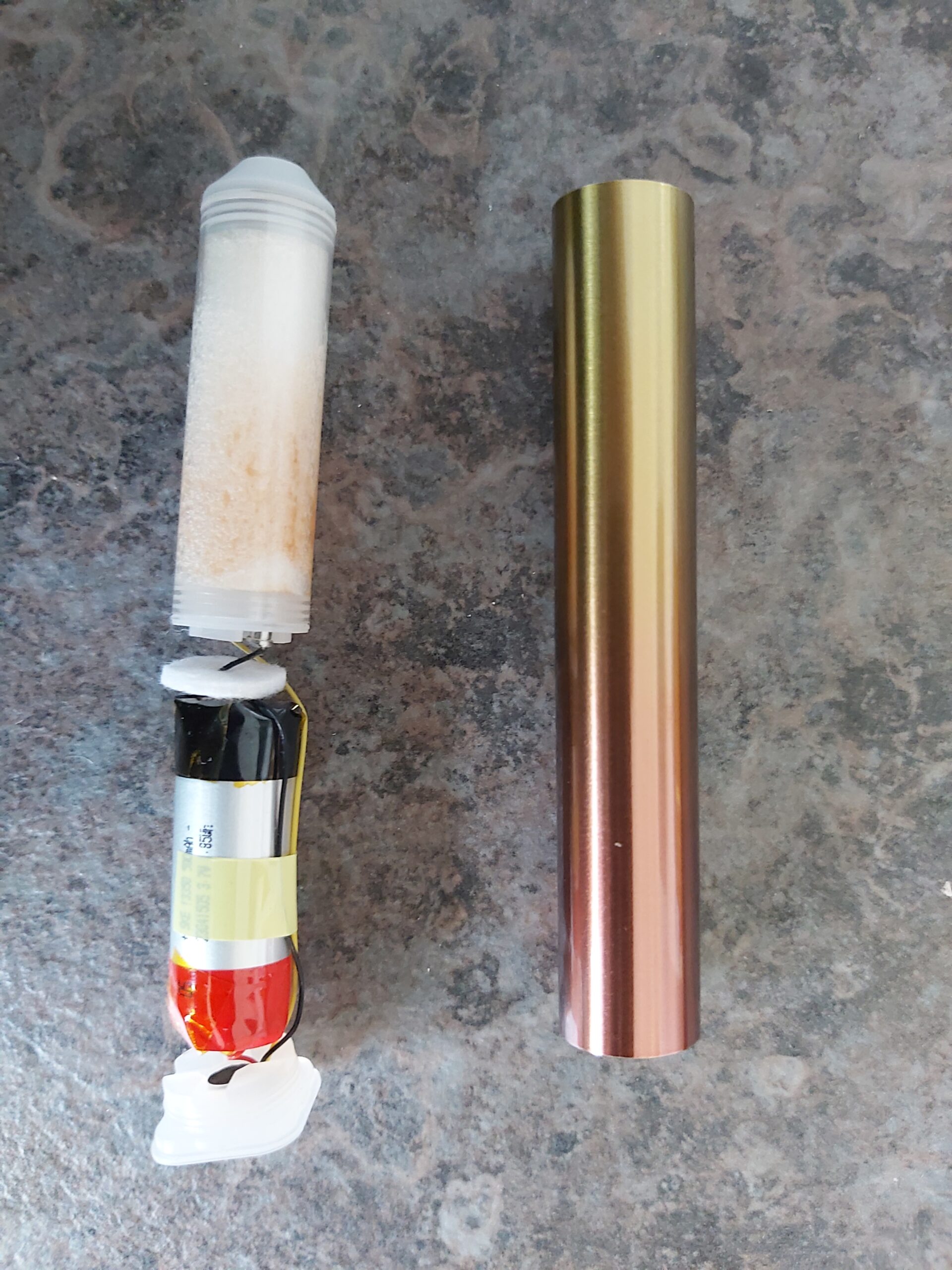 Disassembling Crystal Bar Disposable Electronic Vape or Cigarette Pull Again While Holding The Metal Tube