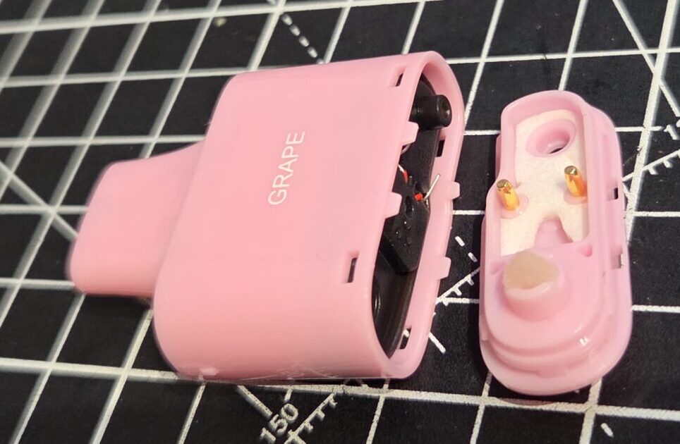 Lost Mary BM6000 Disposable Vape - Pulling the top off of the plastic mouthpiece